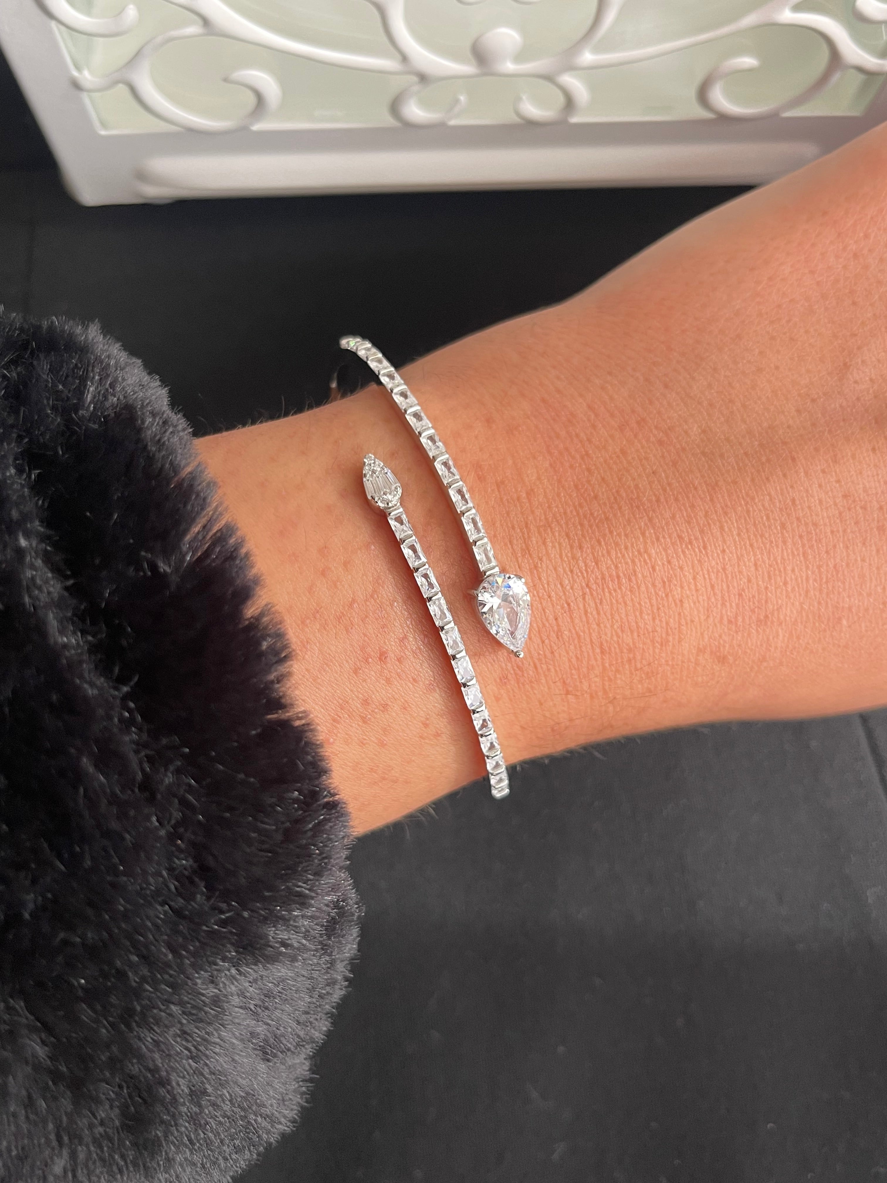 Two oval and multiple crystals silver bangle