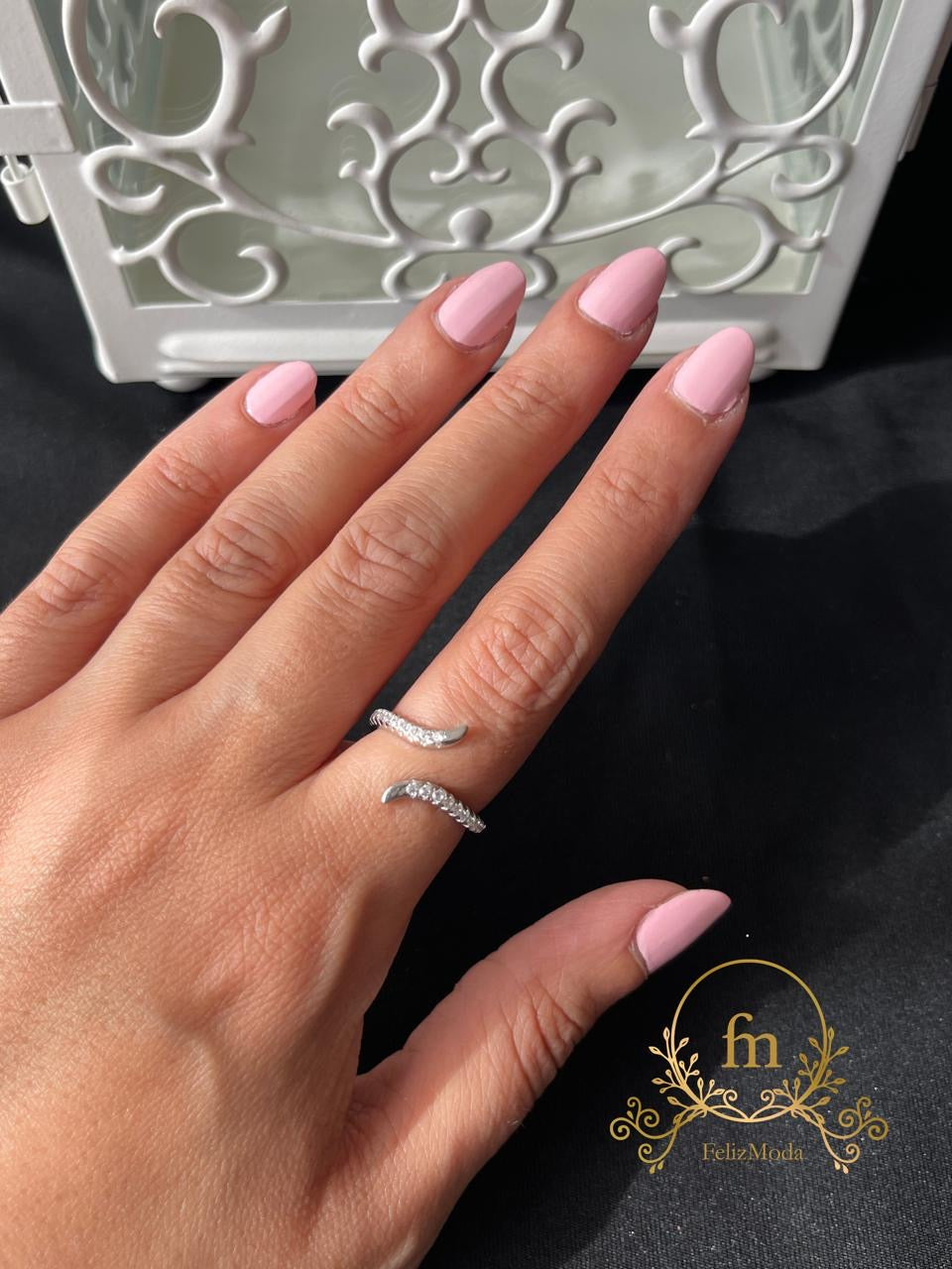 Curved silver ring with zircon stones