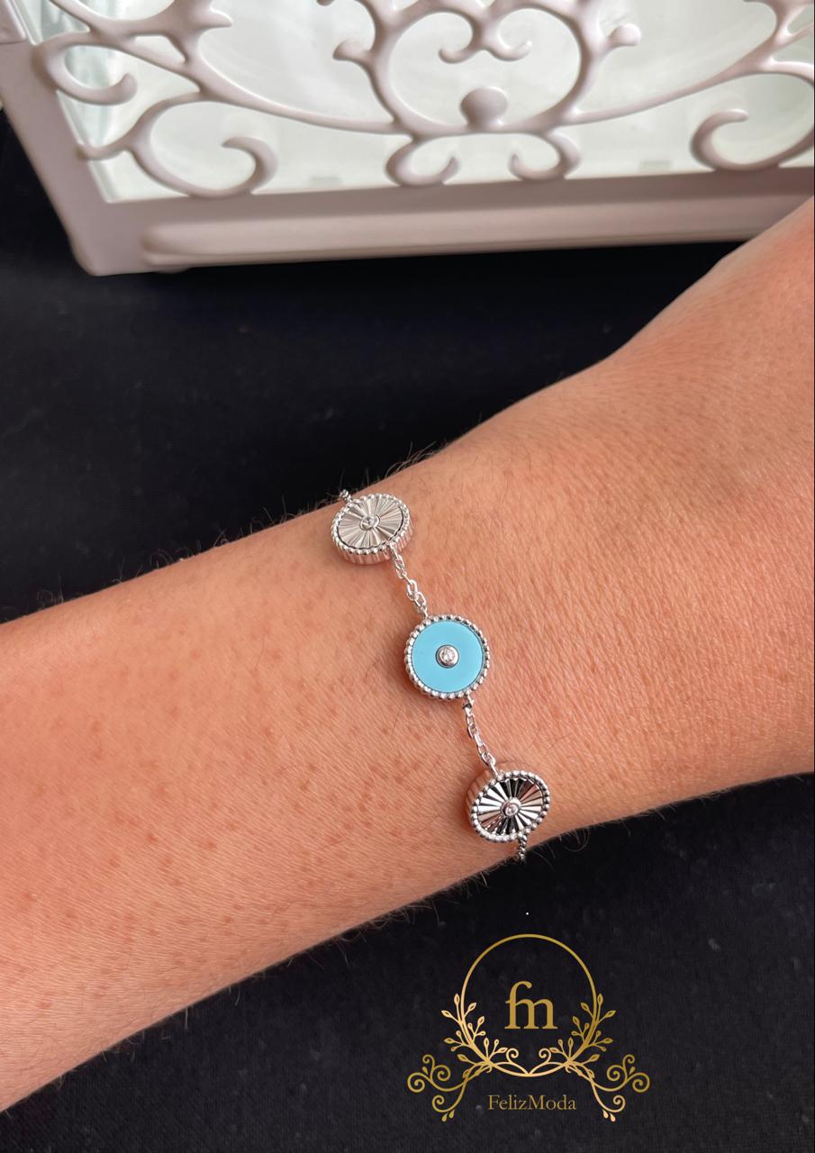 Three round pendants two silver and one Fayrouz silver bracelet