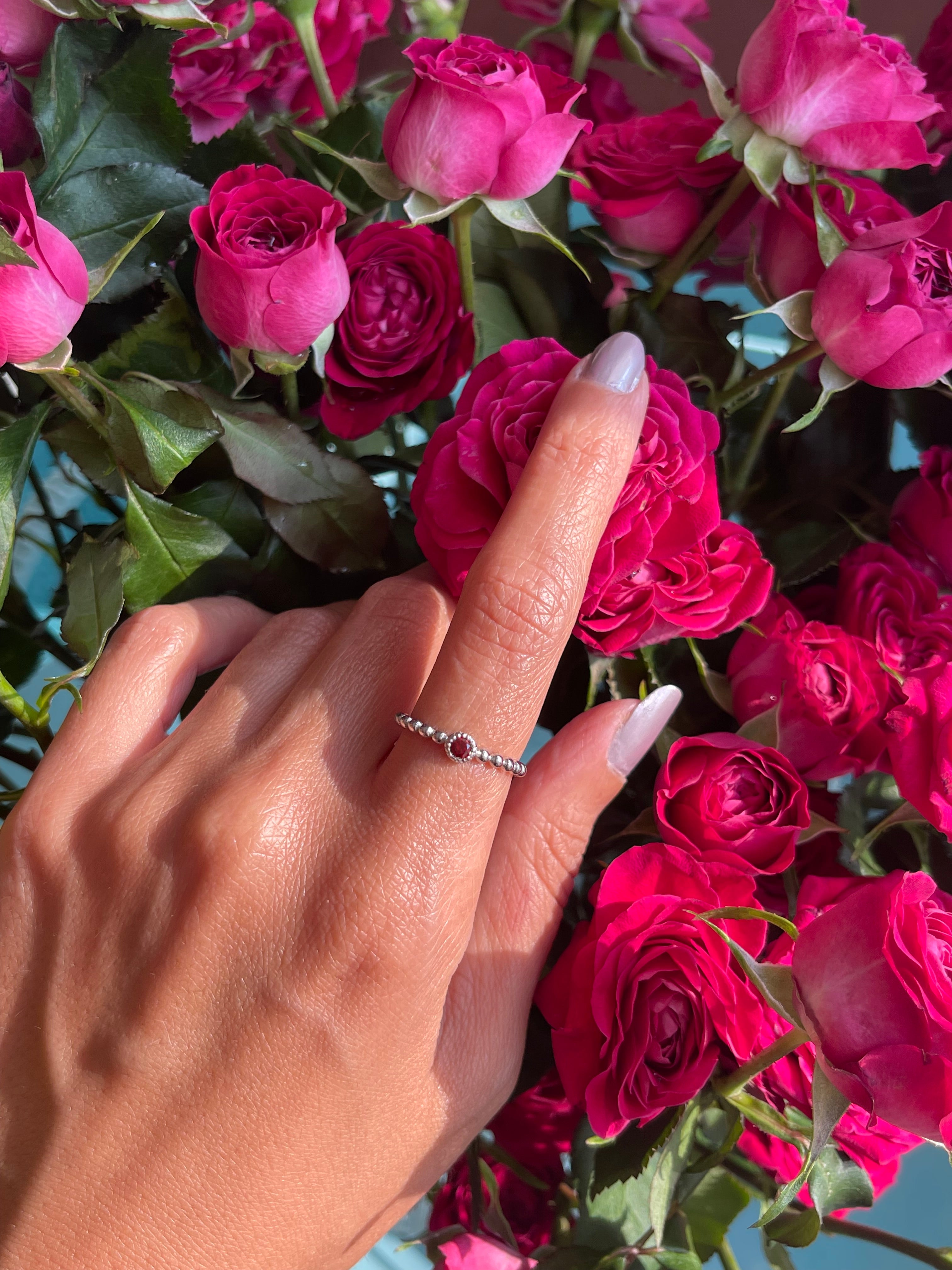 Red stone silver ring with beads