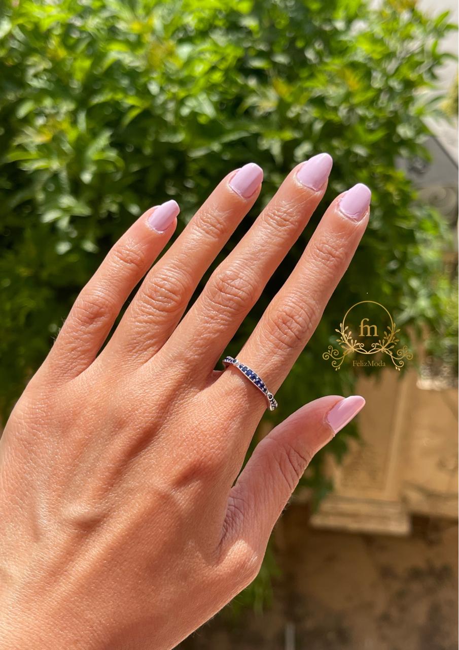 Silver band with multiple blue stones