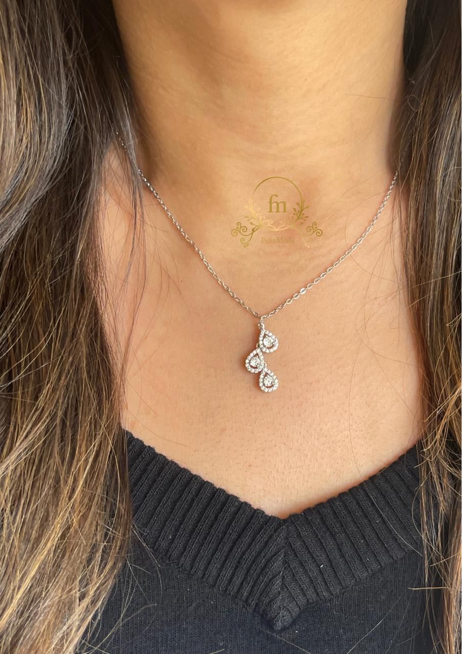 Three oval silver necklaces