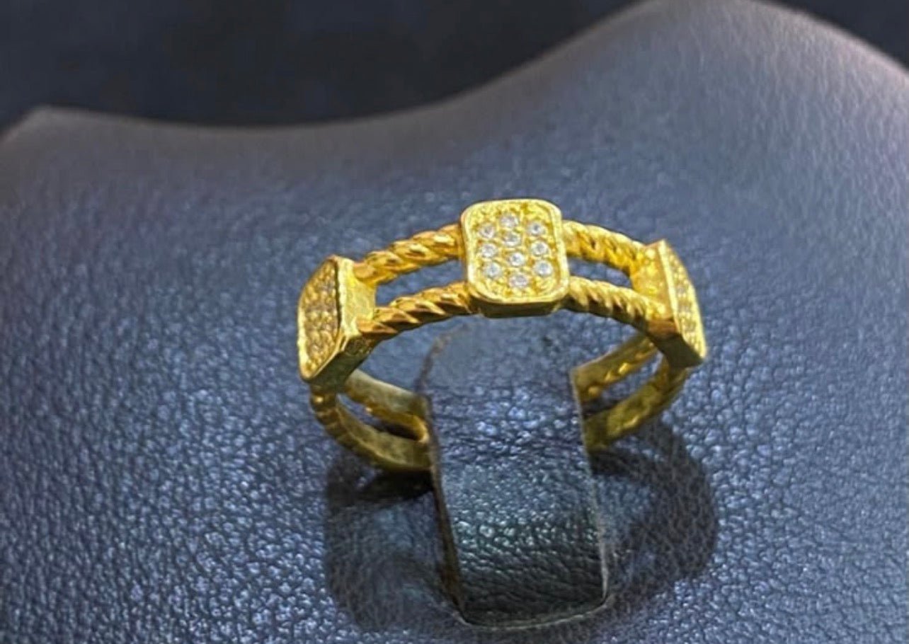 Braided silver ring gold plated with three square stones