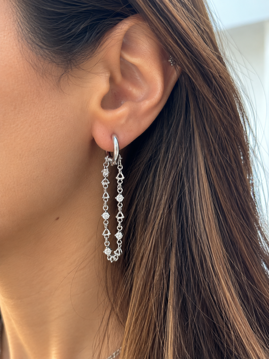 Connected silver earrings with zircon stones ( by piece)