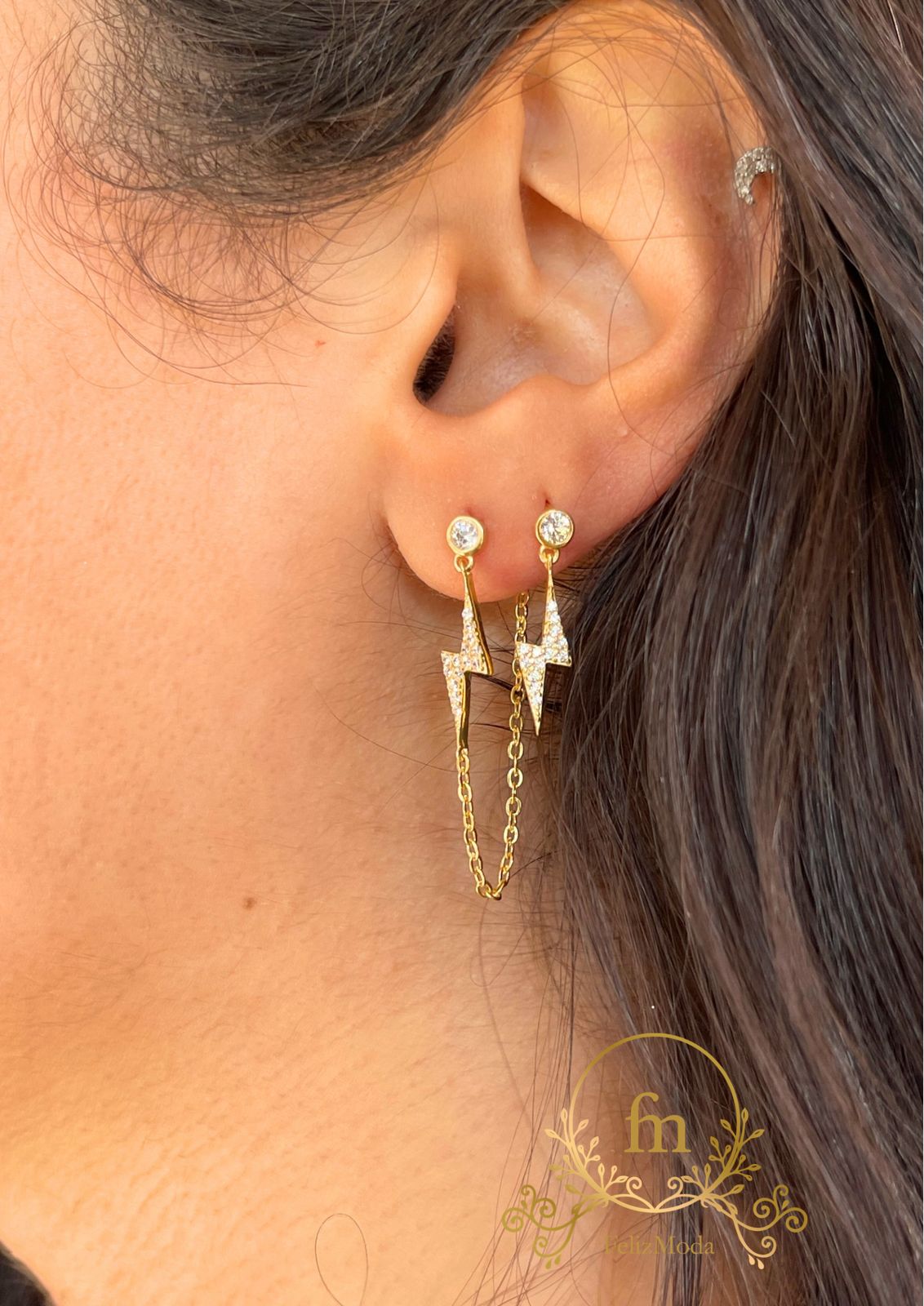 Two pieces flash star silver earrings one plain , one with connected chain gold plated