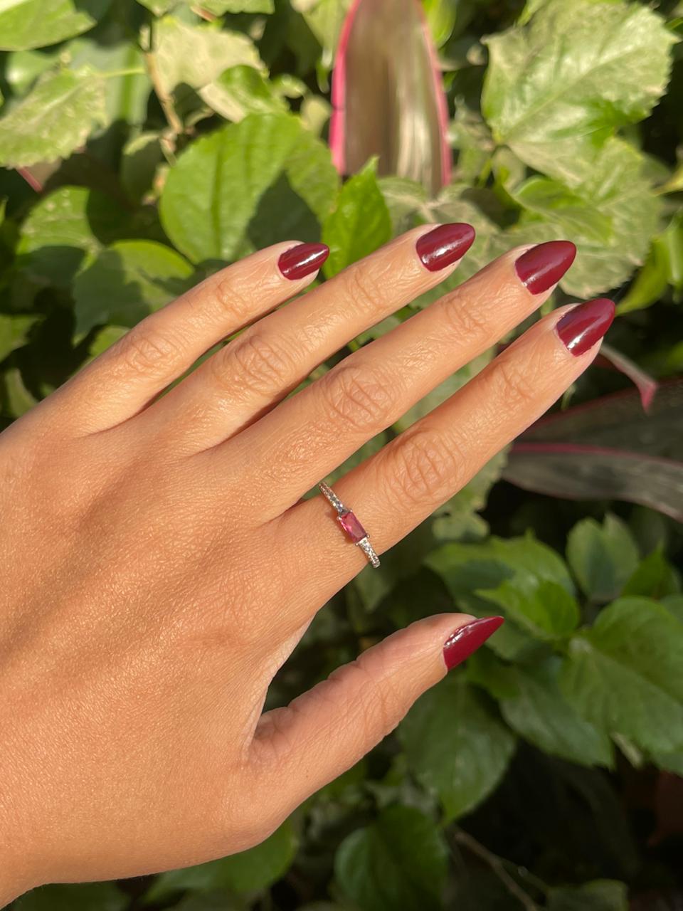 Pink stone silver ring with side stones
