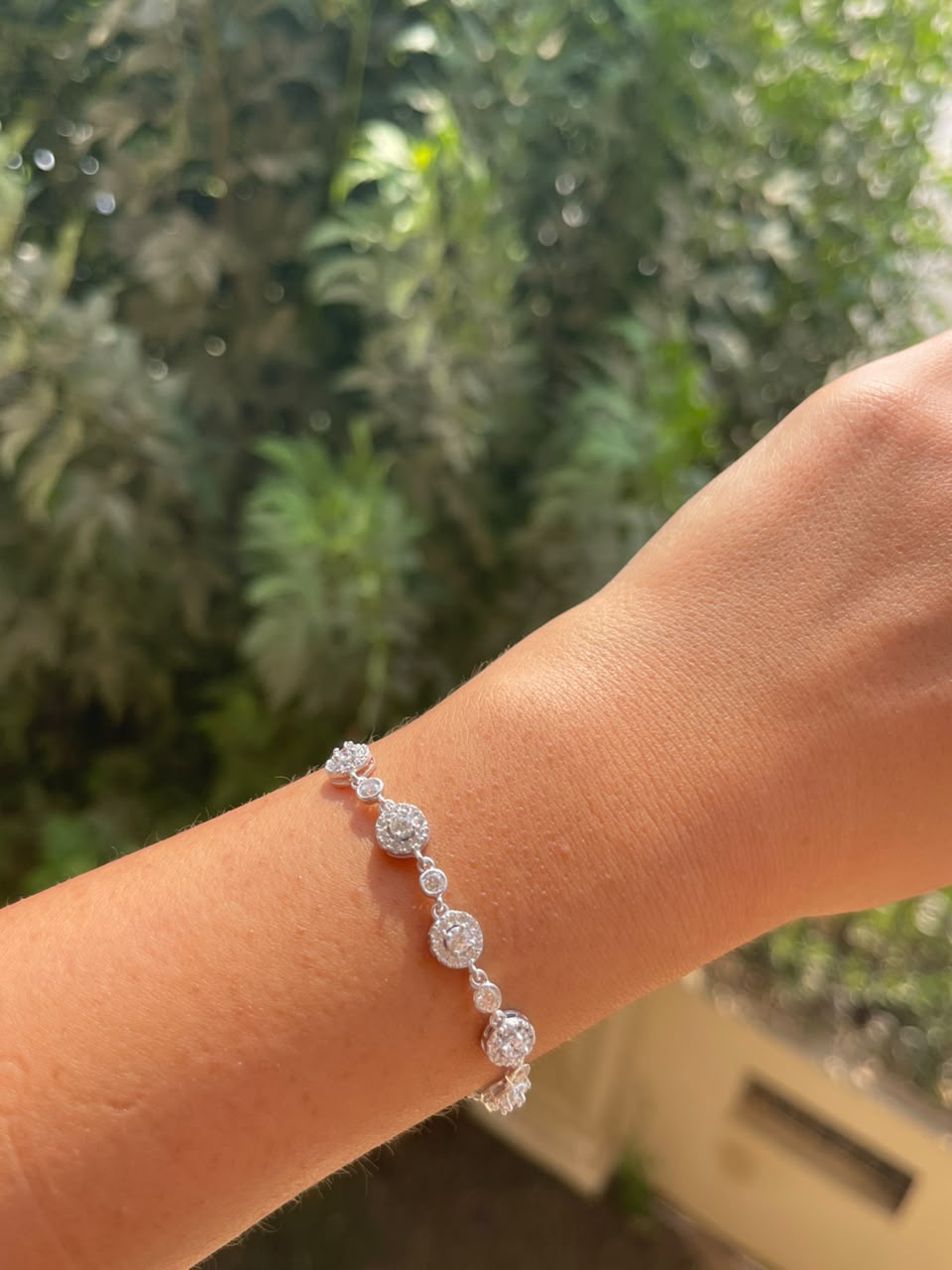 Five round zircon stones silver bracelet