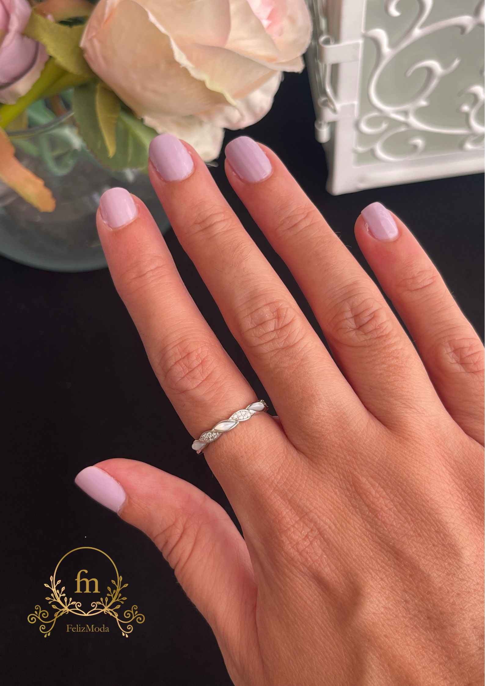 Braided silver ring with white and zircon stones