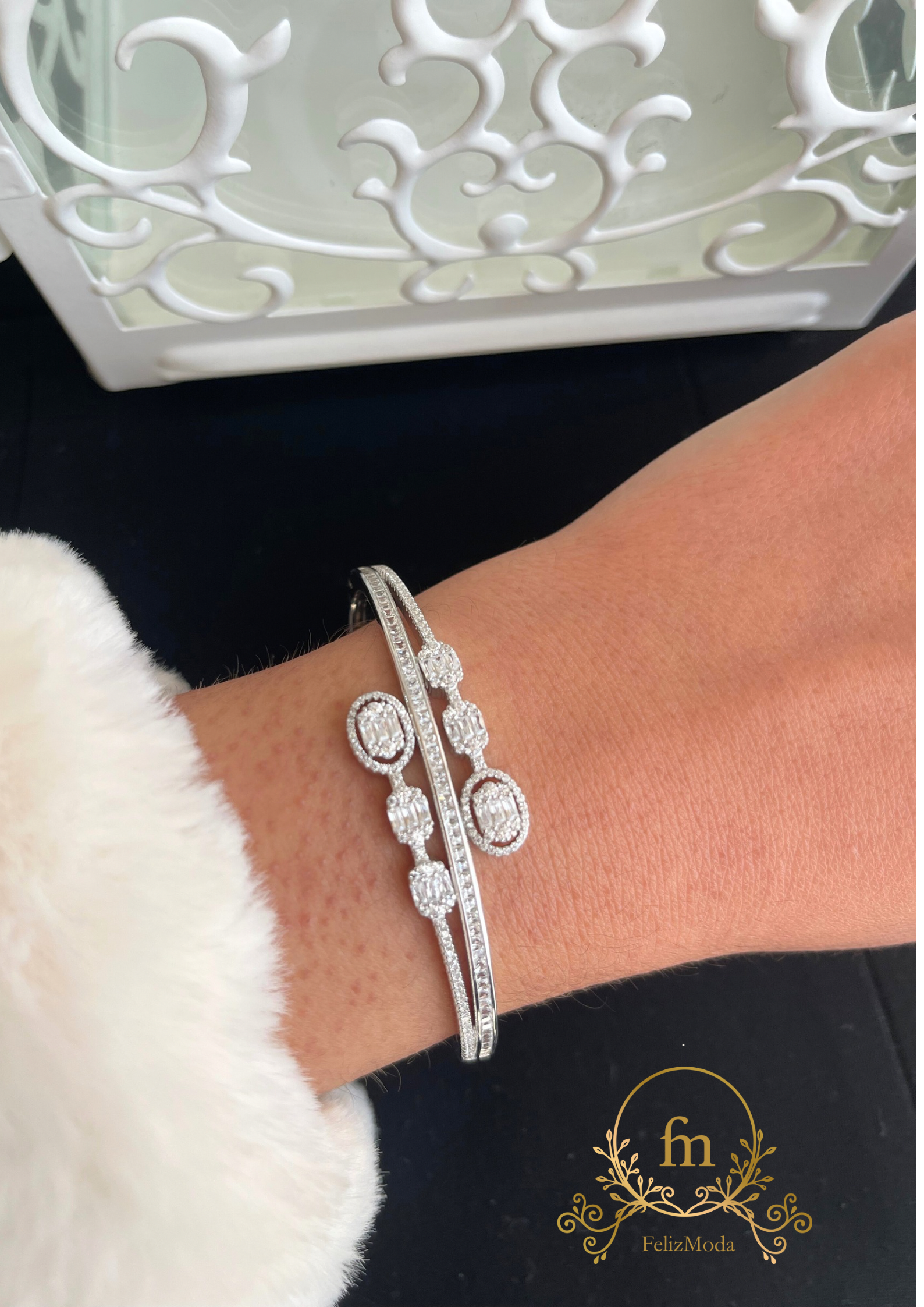 Multiple round  zircon stones silver bangle