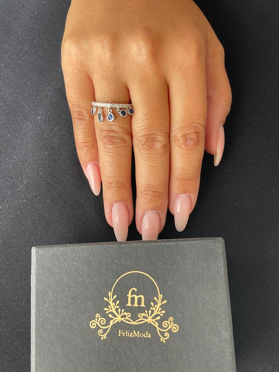 Silver ring with dangling blue stones