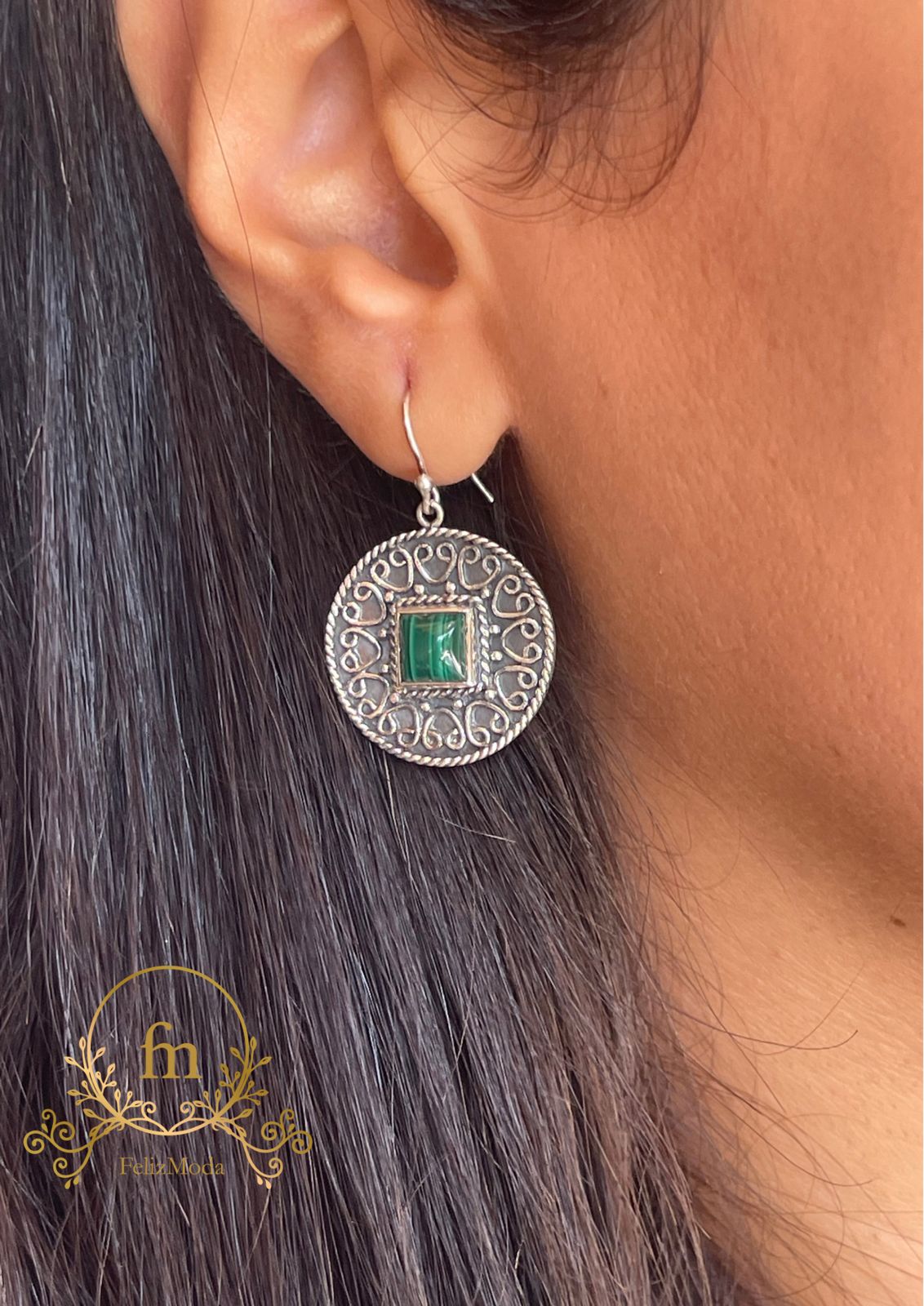 Round silver earrings with green stone