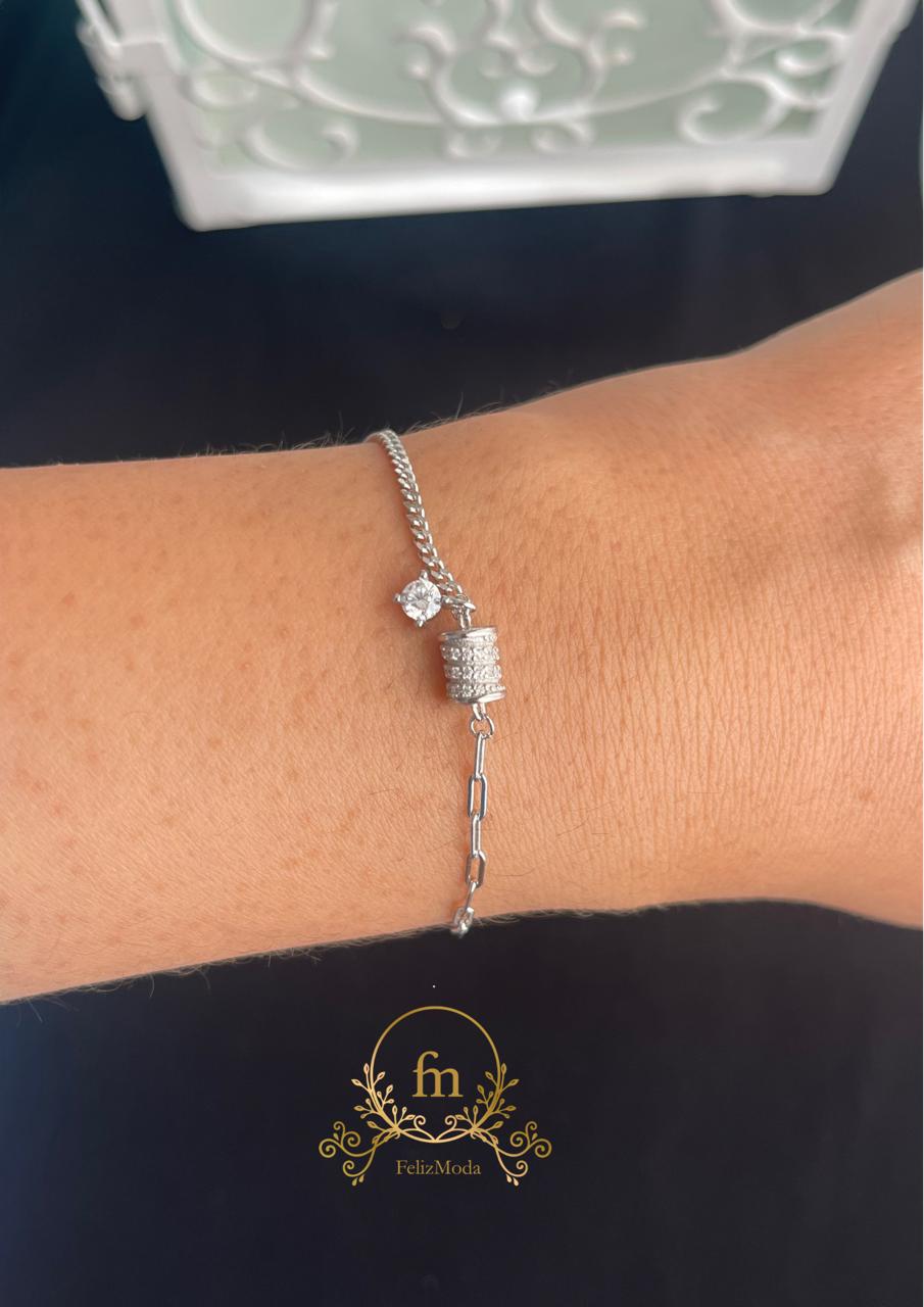 Oval silver bracelet with side stone