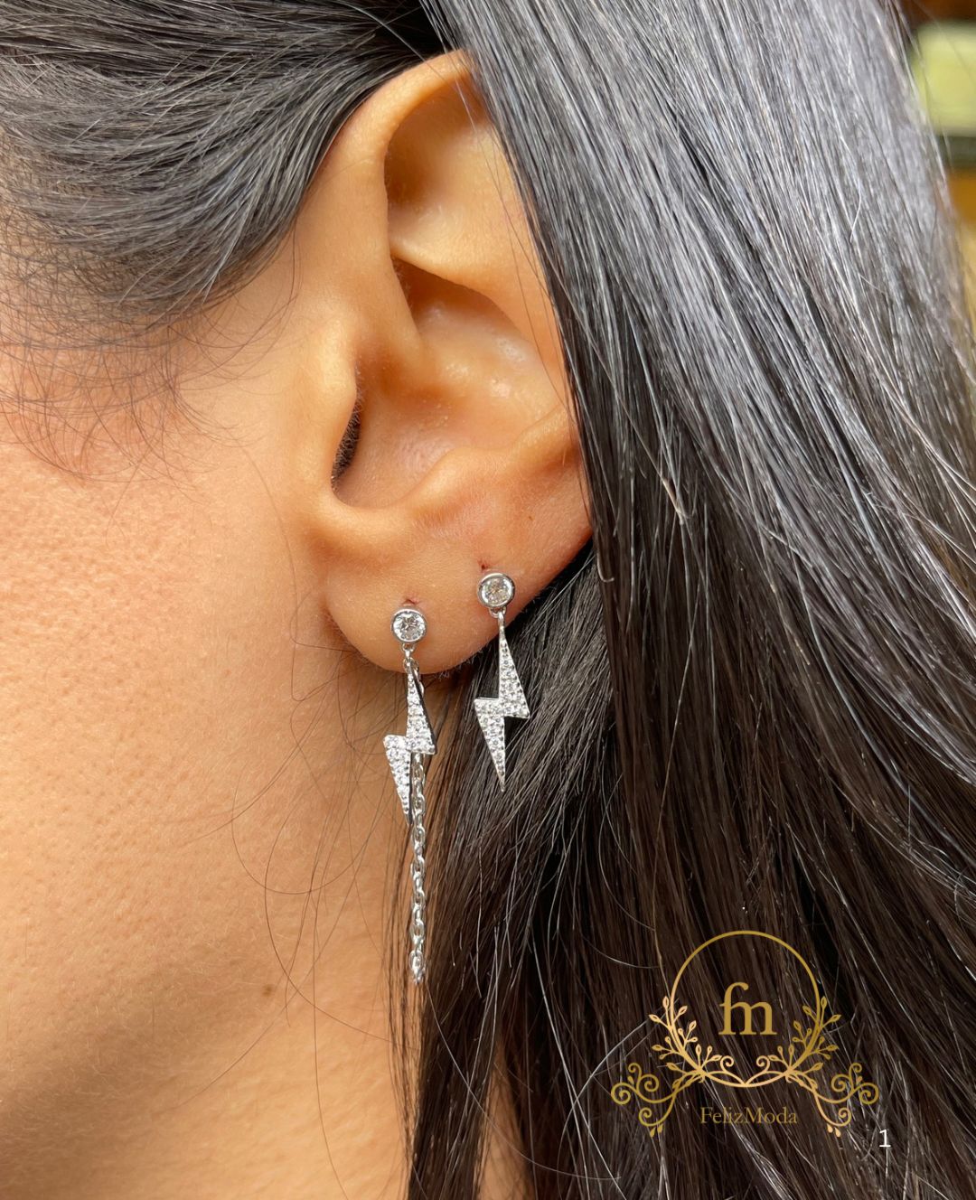 Two pieces flash star silver earrings one plain , one with connected chain