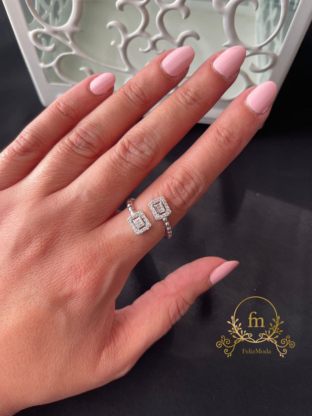Silver braided ring with two squares zircon stones