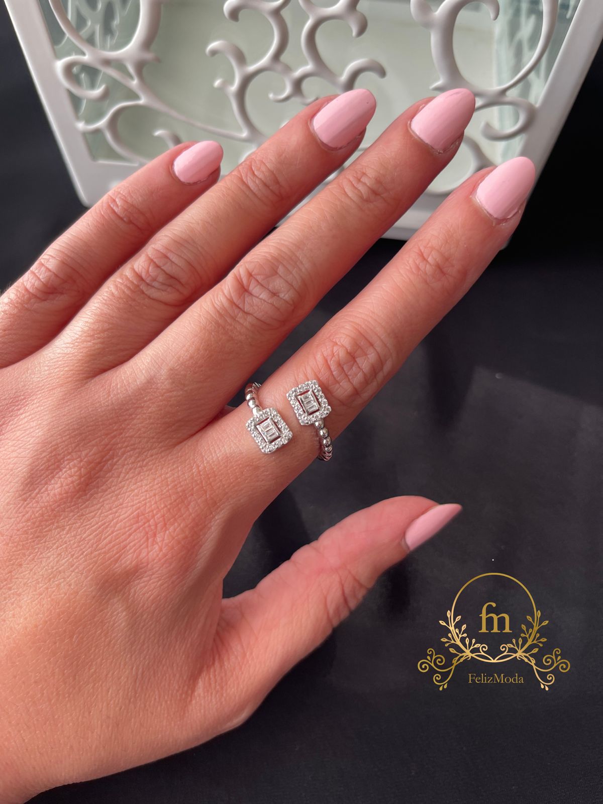 Silver braided ring with two squares zircon stones