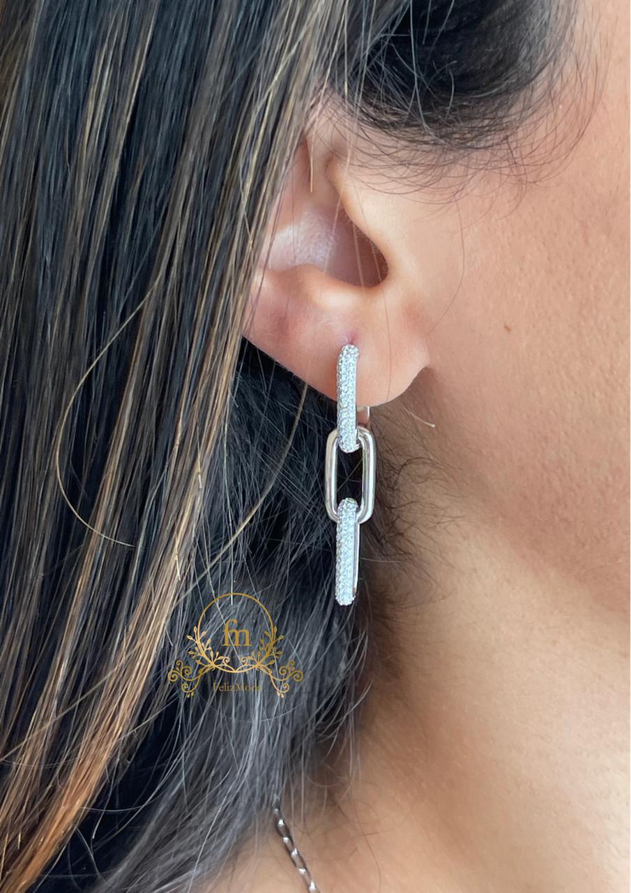 Three connected silver earrings